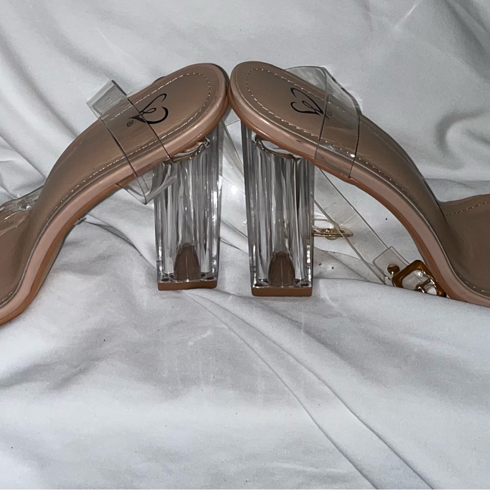 Cinderella style sandals. Clear heals with an added support. Gently used.